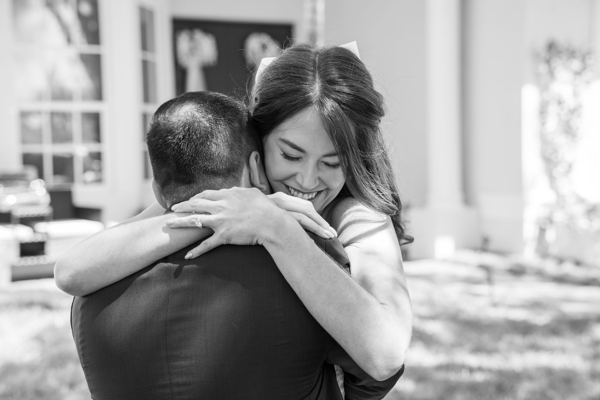 Photographer's perspective capturing a tender moment during a South Florida wedding ceremony
