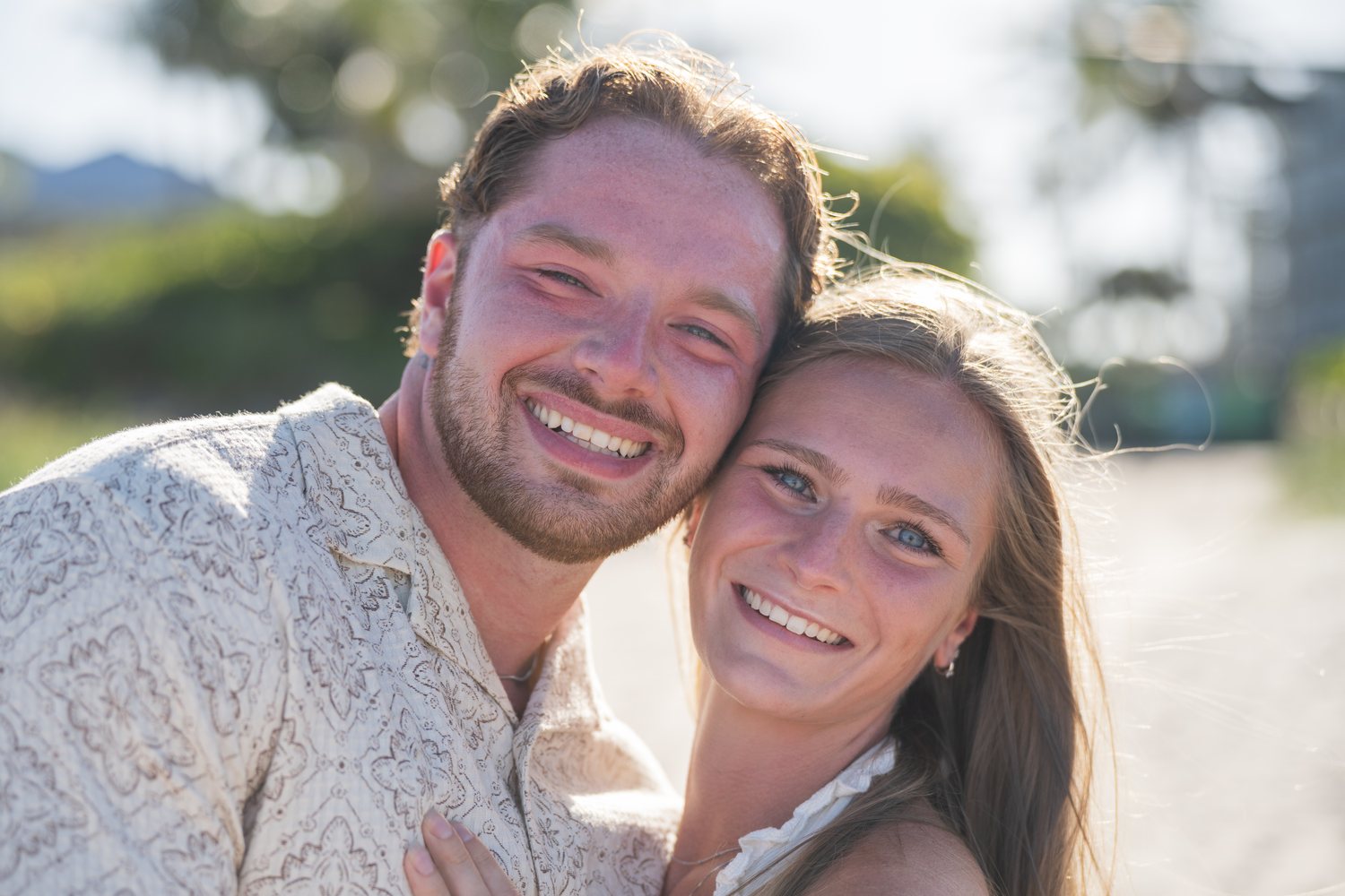 Young couple beach portrait golden hour