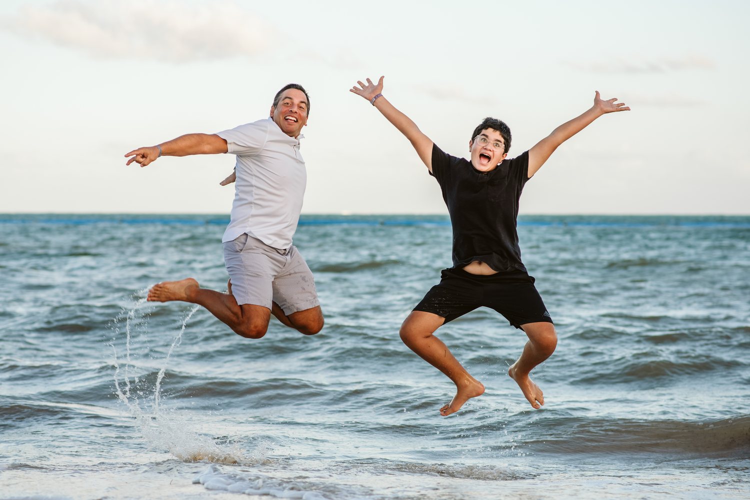 Father and son beach jump South Florida