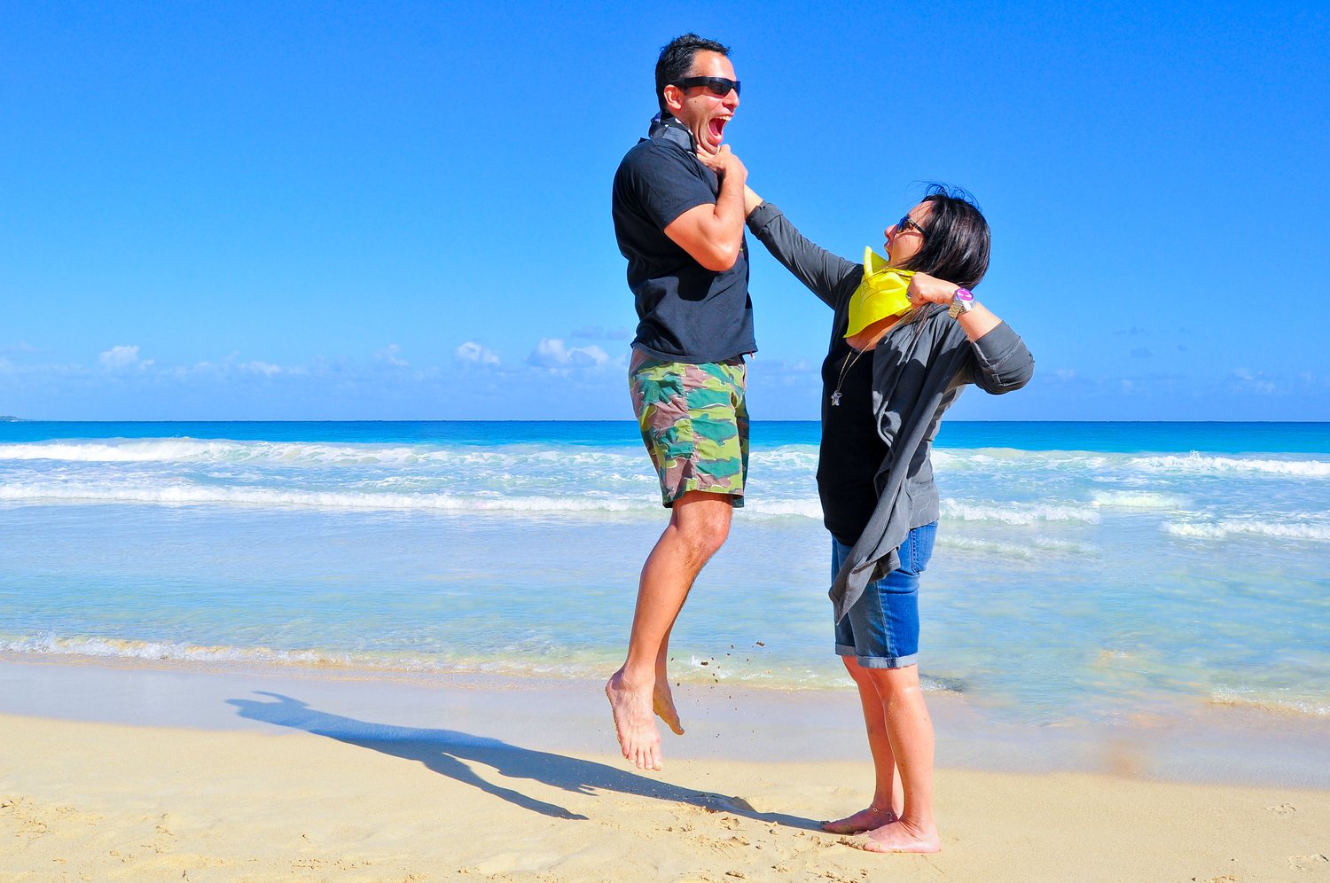 Father and son beach playful portrait