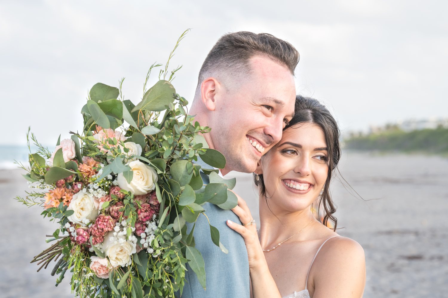Bride and groom beach portrait bouquet